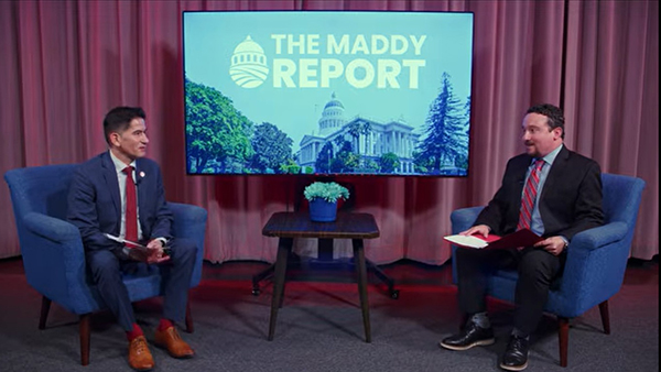 Fresno State President Sa&uacute;l Jim&eacute;nez-Sandoval (left) and Blake Zante, executive director of The Maddy Institute, sit in chairs for the The Maddy Report. A television hangs on the wall behind them.