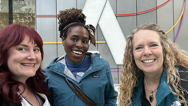 Courtney Hughes (left), Dr. Nkenna Onwuzuruoha (center), and Dr. Ginny Crisco (right) outside the International Adobe Headquarters in San Jose, CA.