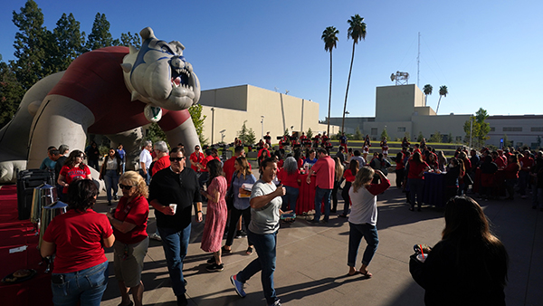 Fresno State staff gather in the Leon S. Peter's Event Plaza at the RSU for the Homecoming Red Friday.
