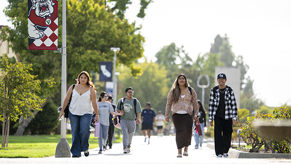 Students walk down the center of campus.